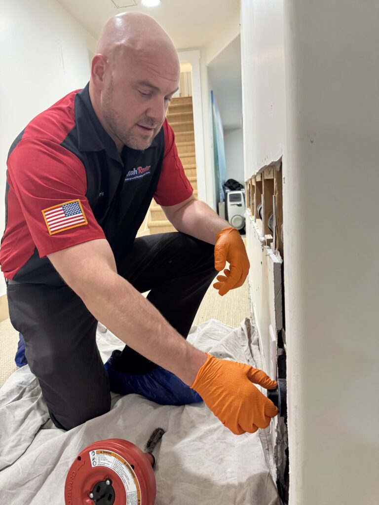 Utah Rooter technician working a Provo sewer lateral